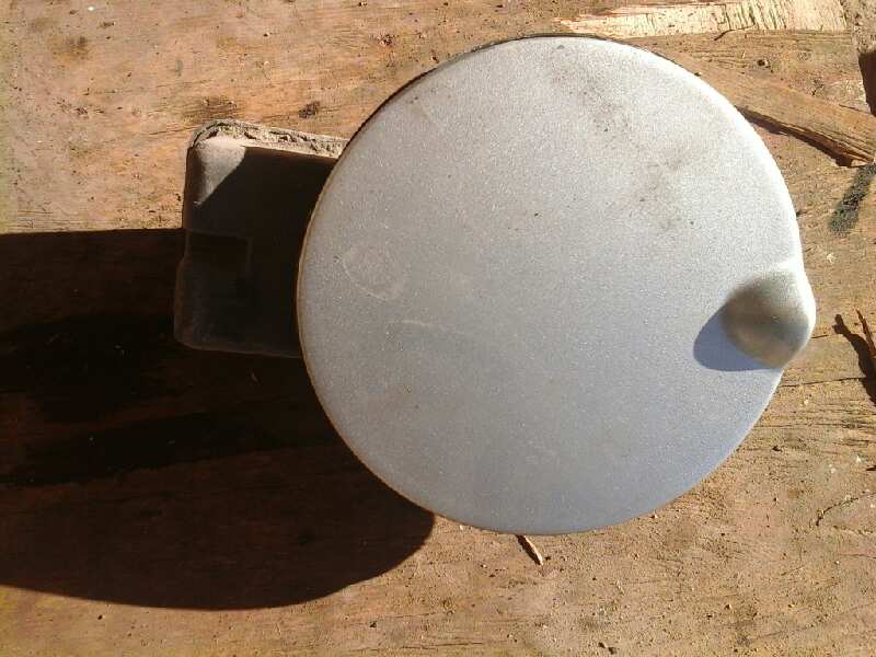 TAPA EXTERIOR COMBUSTIBLE