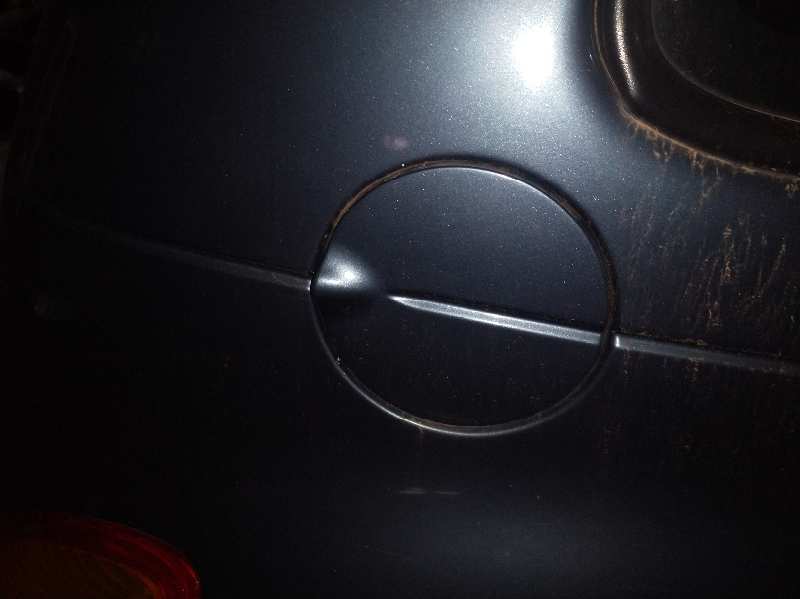 TAPA EXTERIOR COMBUSTIBLE