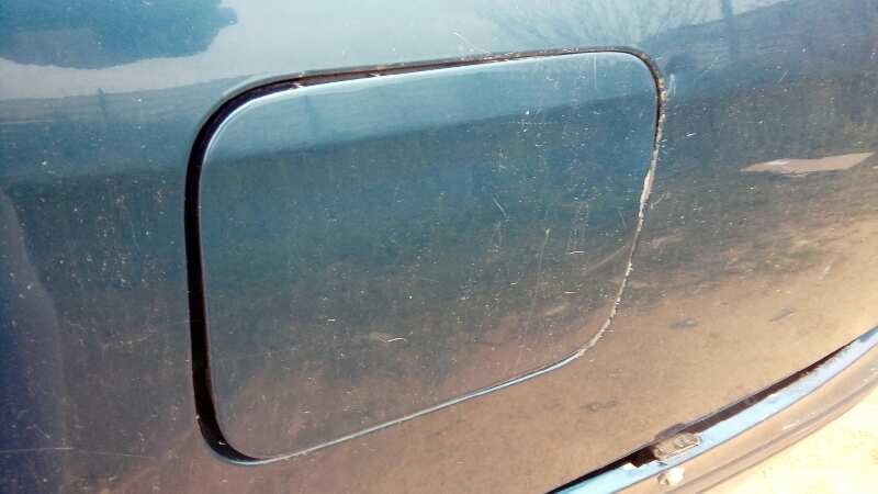 TAPA EXTERIOR COMBUSTIBLE