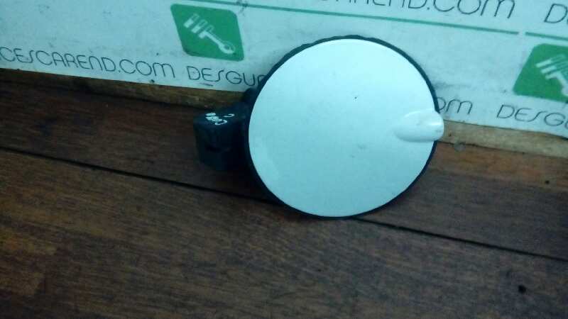 TAPA EXTERIOR COMBUSTIBLE