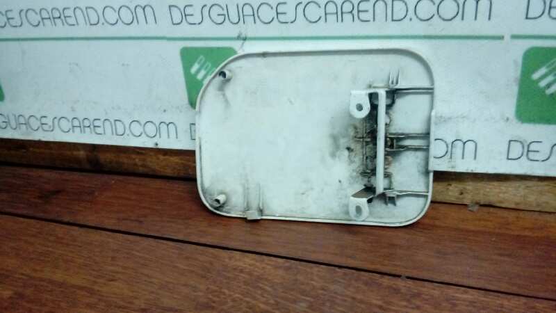 TAPA EXTERIOR COMBUSTIBLE