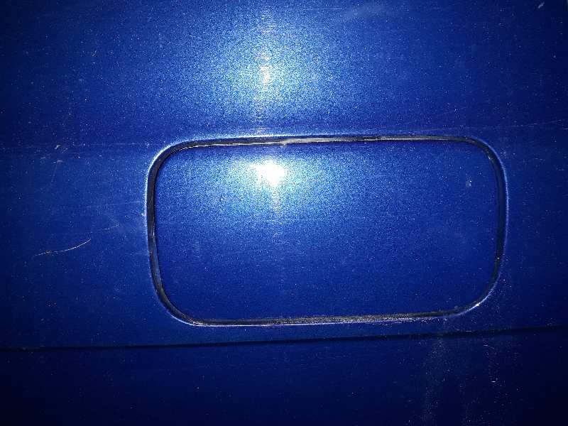 TAPA EXTERIOR COMBUSTIBLE