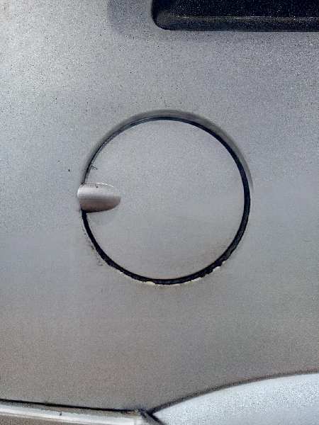 TAPA EXTERIOR COMBUSTIBLE