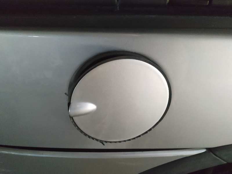 TAPA EXTERIOR COMBUSTIBLE